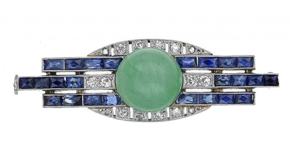 Appraisal: A JADE DIAMOND AND SAPPHIRE BROOCH of geometric design centred