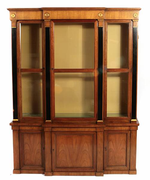 Appraisal: A Neoclassical style walnut and ebonized breakfront bookcase height ft