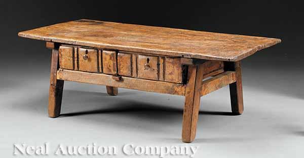 Appraisal: An Antique Spanish Carved Low Table the plank top over