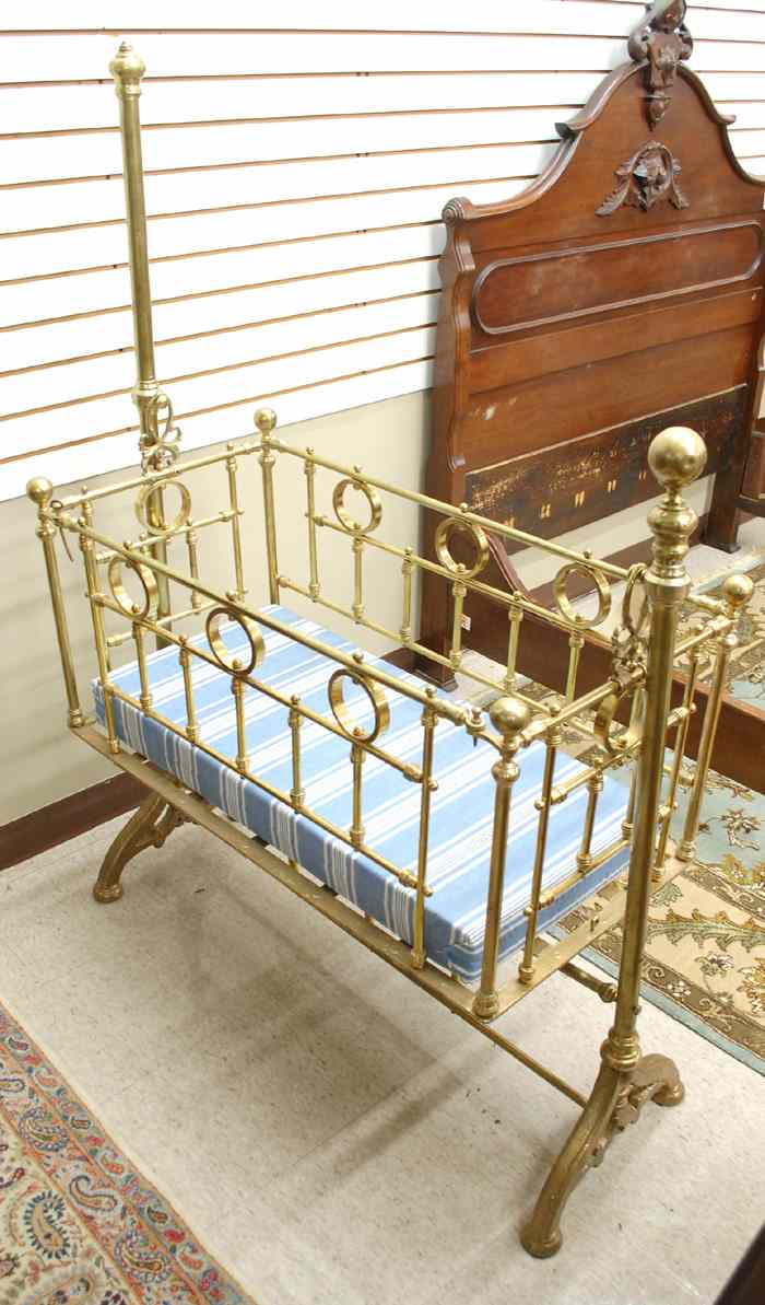 Appraisal: VICTORIAN BRASS AND CAST IRON BABY CRADLE AND FLOOR STAND