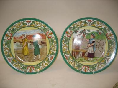 Appraisal: A PAIR OF WEDGWOOD POTTERY MONTH PLATES printed and painted