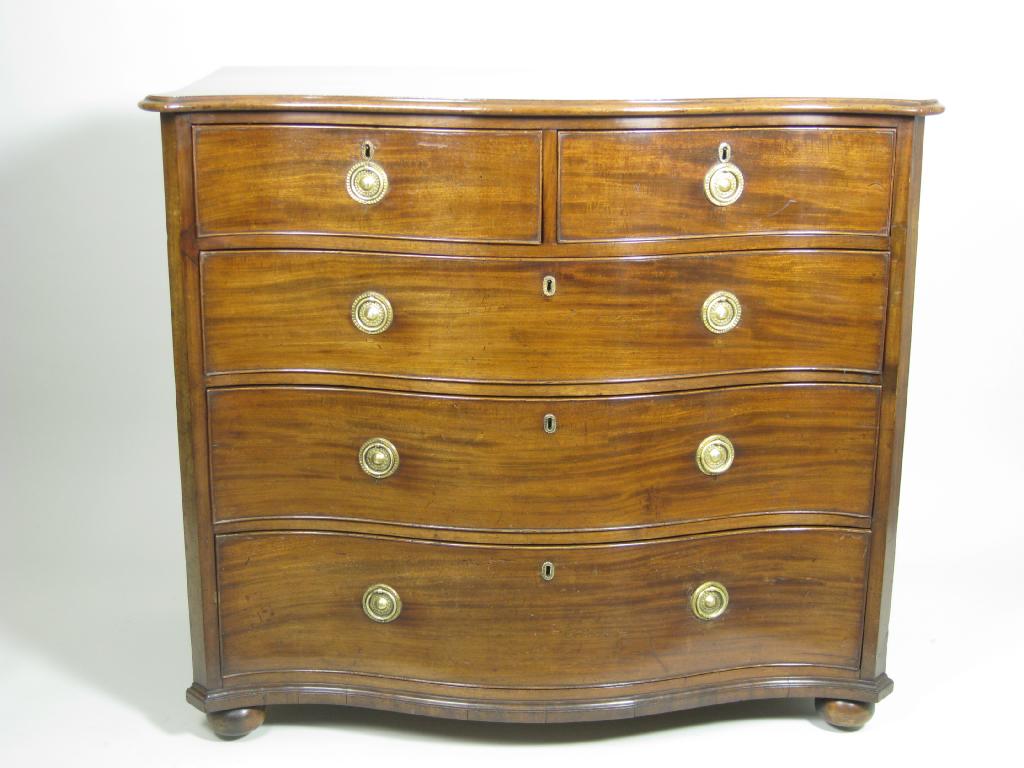 Appraisal: A Georgian mahogany Serpentine Chest of two short and three