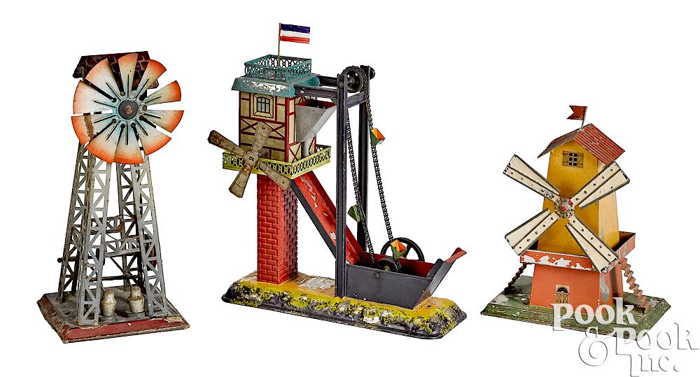 Appraisal: Three windmill steam toy accessories Three painted and embossed tin