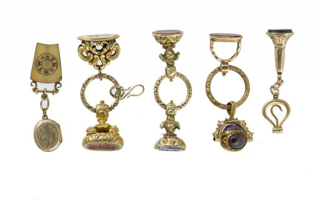 Appraisal: SEVEN VICTORIAN GOLD AND GOLD MOUNTED FOB SEALS THREE SPLIT