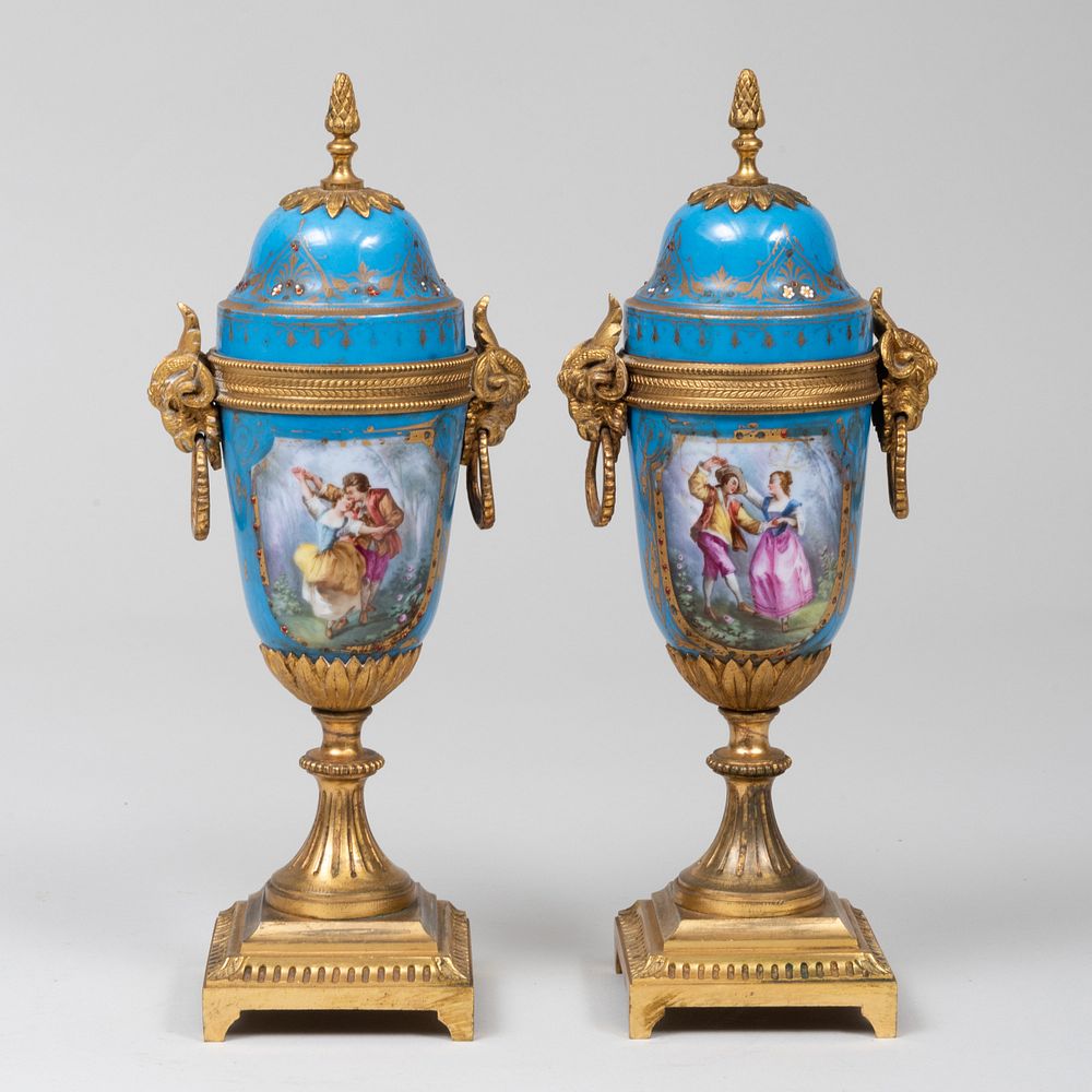 Appraisal: Pair of Louis XVI Style Gilt-Bronze-Mounted Porcelain Covered Urns x