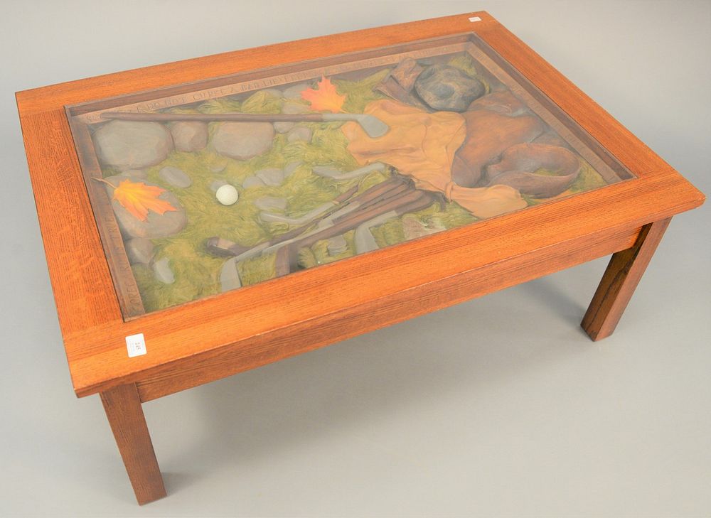 Appraisal: Carved golf etiquette coffee table having carved interior with glass