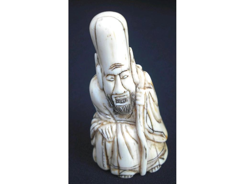 Appraisal: Carved ivory netsuke by Jorajn modelled as a seated robed