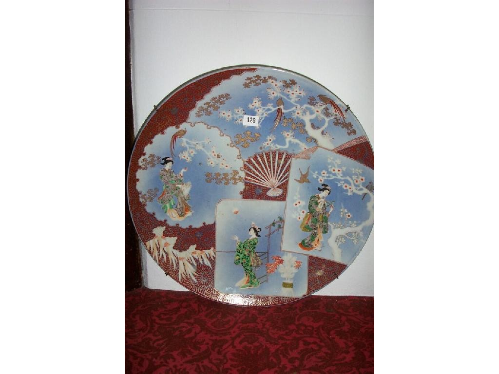 Appraisal: A large Japanese charger with painted panels showing elegant female