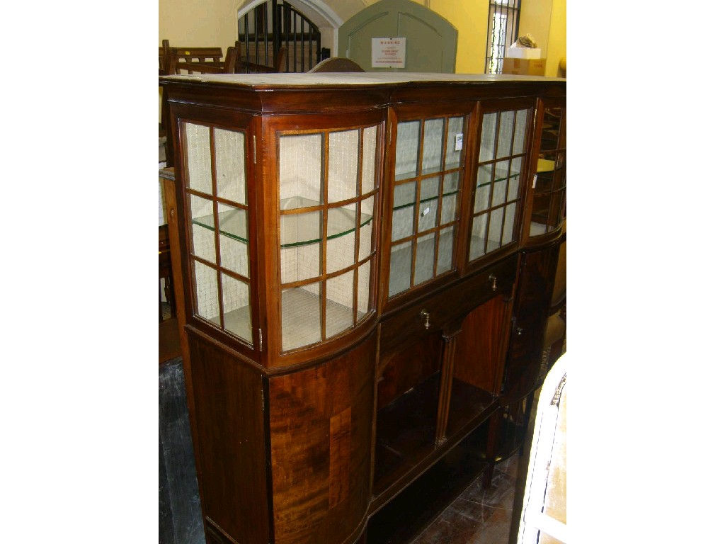 Appraisal: An Edwardian walnut display cabinet enclosed by an arrangement of