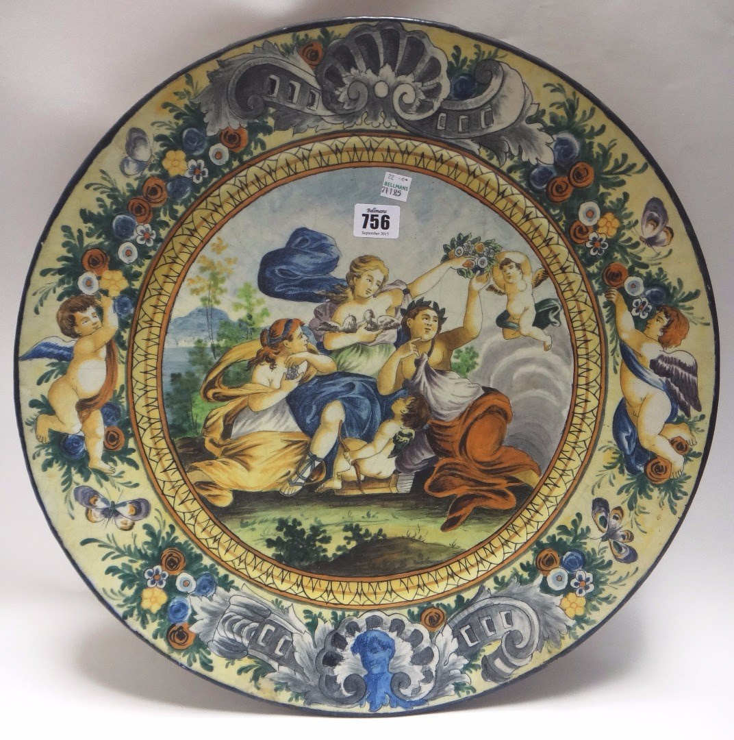 Appraisal: An Italian majolica charger th century decorated with a lady