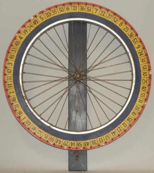 Appraisal: Wooden Metal Gaming Wheel Circa Consists of a bike wheel