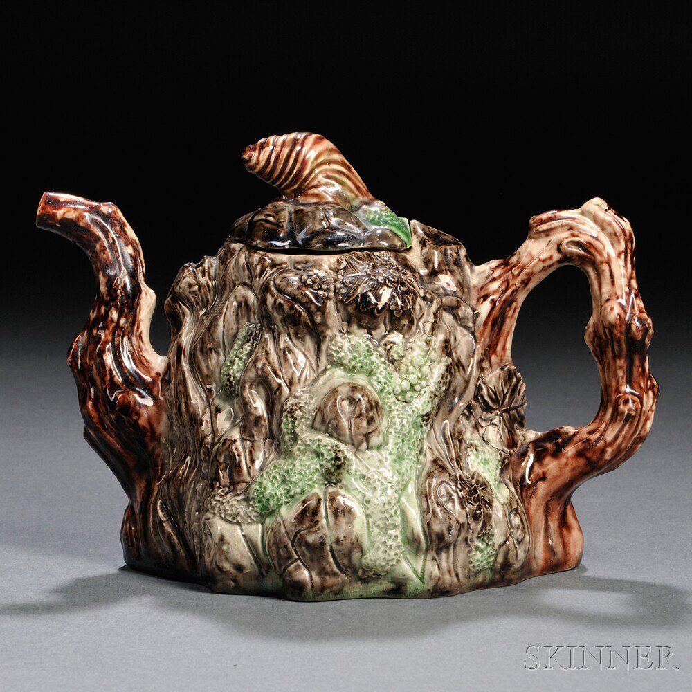 Appraisal: Staffordshire Cream-colored Earthenware Tree Trunk-form Teapot and Cover England c