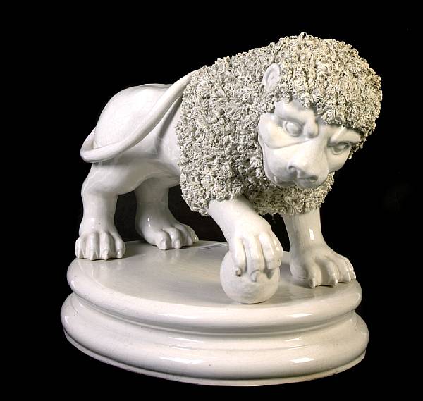 Appraisal: A Continental glazed earthenware model of a lion height in