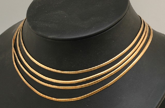 Appraisal: A GOLD NECKLACE The Italian ct gold necklace of four