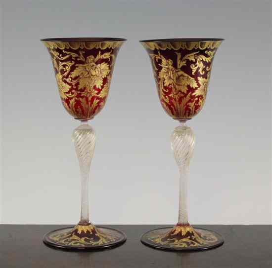 Appraisal: A pair of Venetian gilt decorated ruby and clear glass