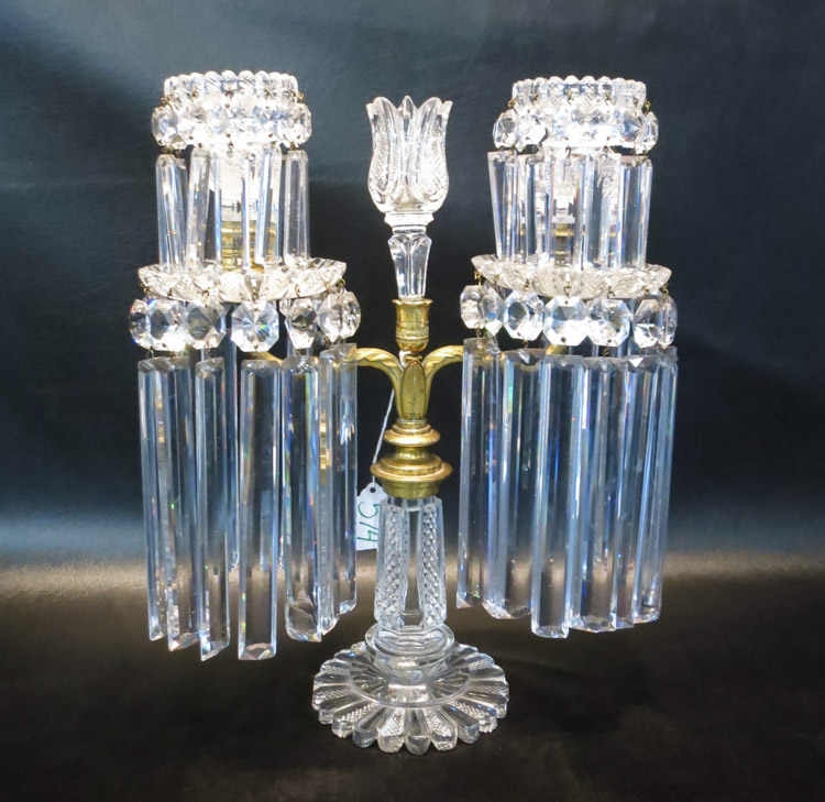 Appraisal: A GILT METAL AND CUT CRYSTAL LUSTRE CANDLEHOLDER the double-arm