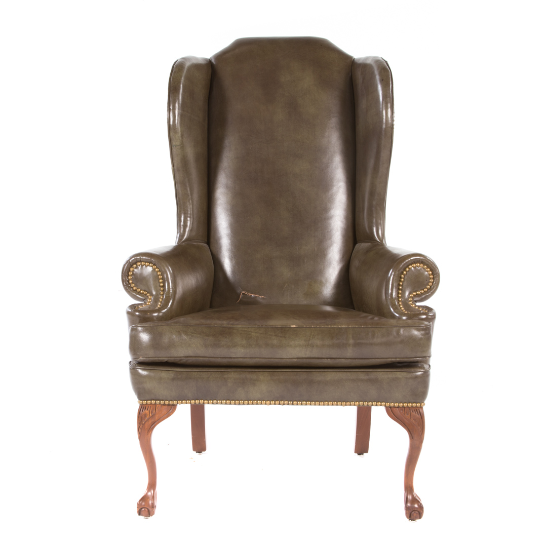 Appraisal: George III style leather upholstered wing chair th century upholstered