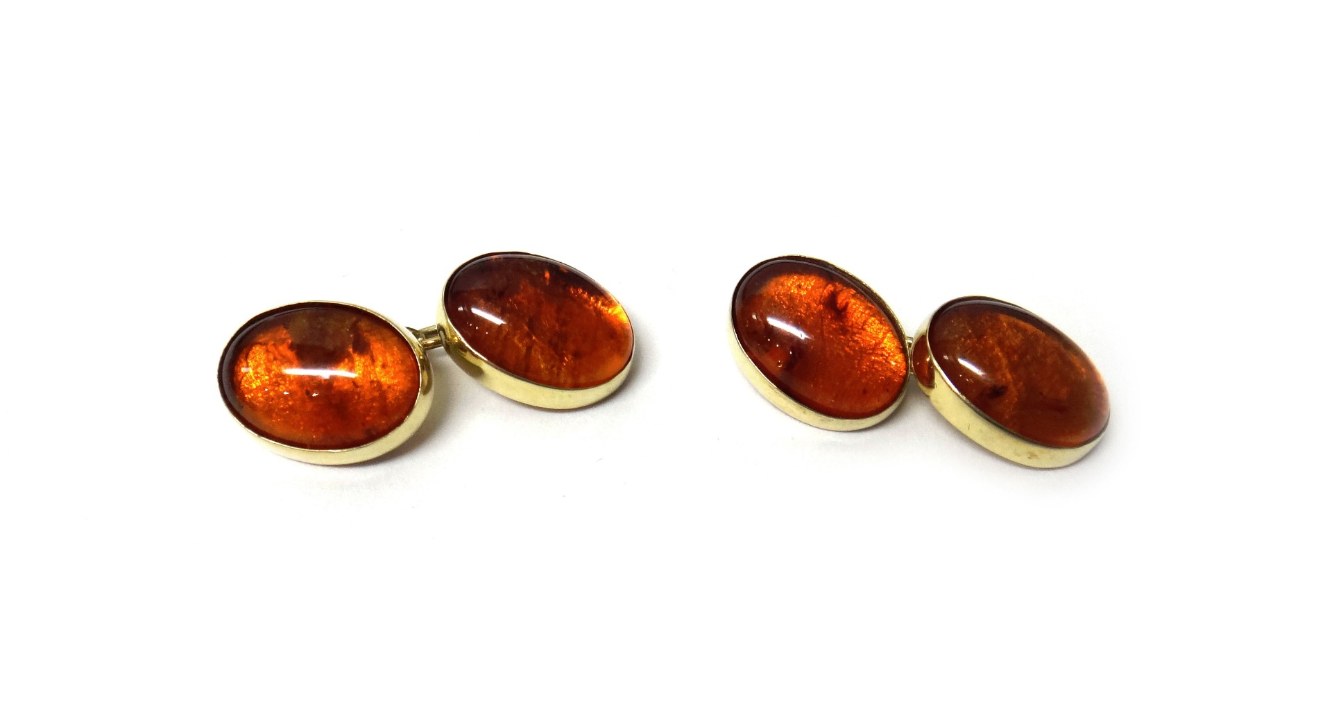 Appraisal: A pair of ct gold and cabochon amber dress cufflinks