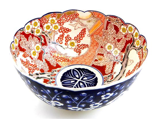 Appraisal: ASIAN Imari bowl with blue and white cherry blossom exterior