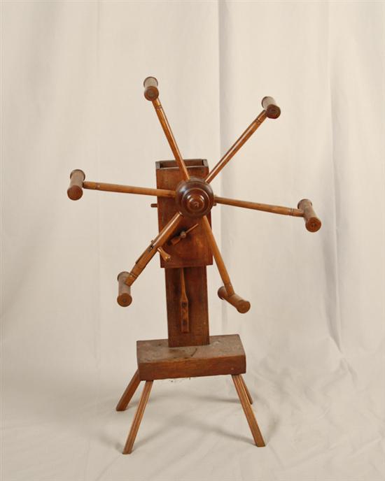 Appraisal: A Mixed Wood Yarn Winder with turned spinner and spindles