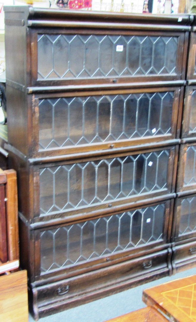 Appraisal: A Globe Wernicke oak four tier bookcase with leaded glazed