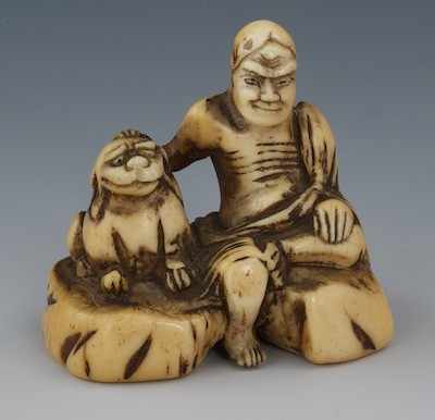 Appraisal: A Carved Ivory Netsuke of a Hermit with a Dog