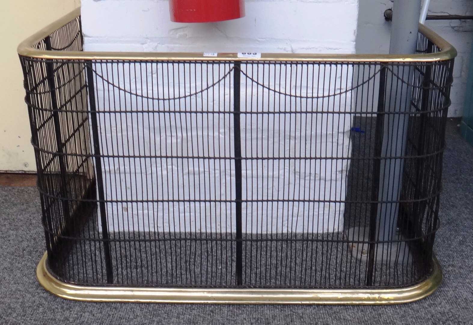 Appraisal: A Georgian wirework brass mounted fire guard cm wide and