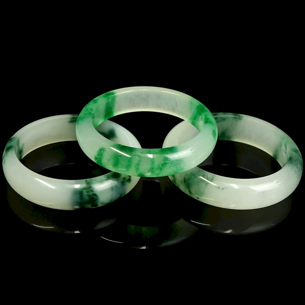 Appraisal: Three Chinese Jade Bangle Bracelets Three Chinese Jade Bangle Bracelets