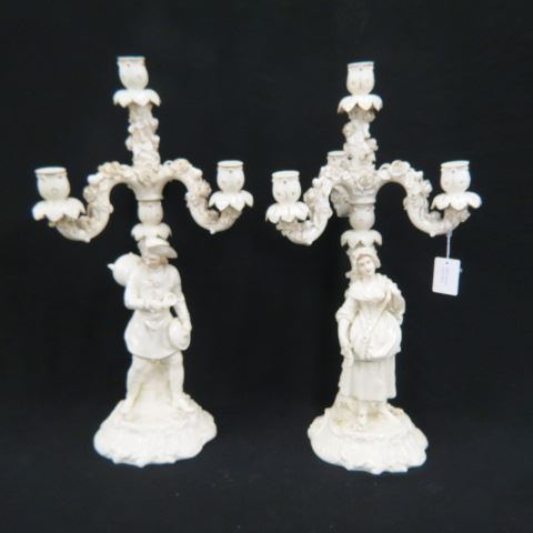 Appraisal: Pair of Royal Rudolstadt Porcelain Candelabra figural farm boy girl