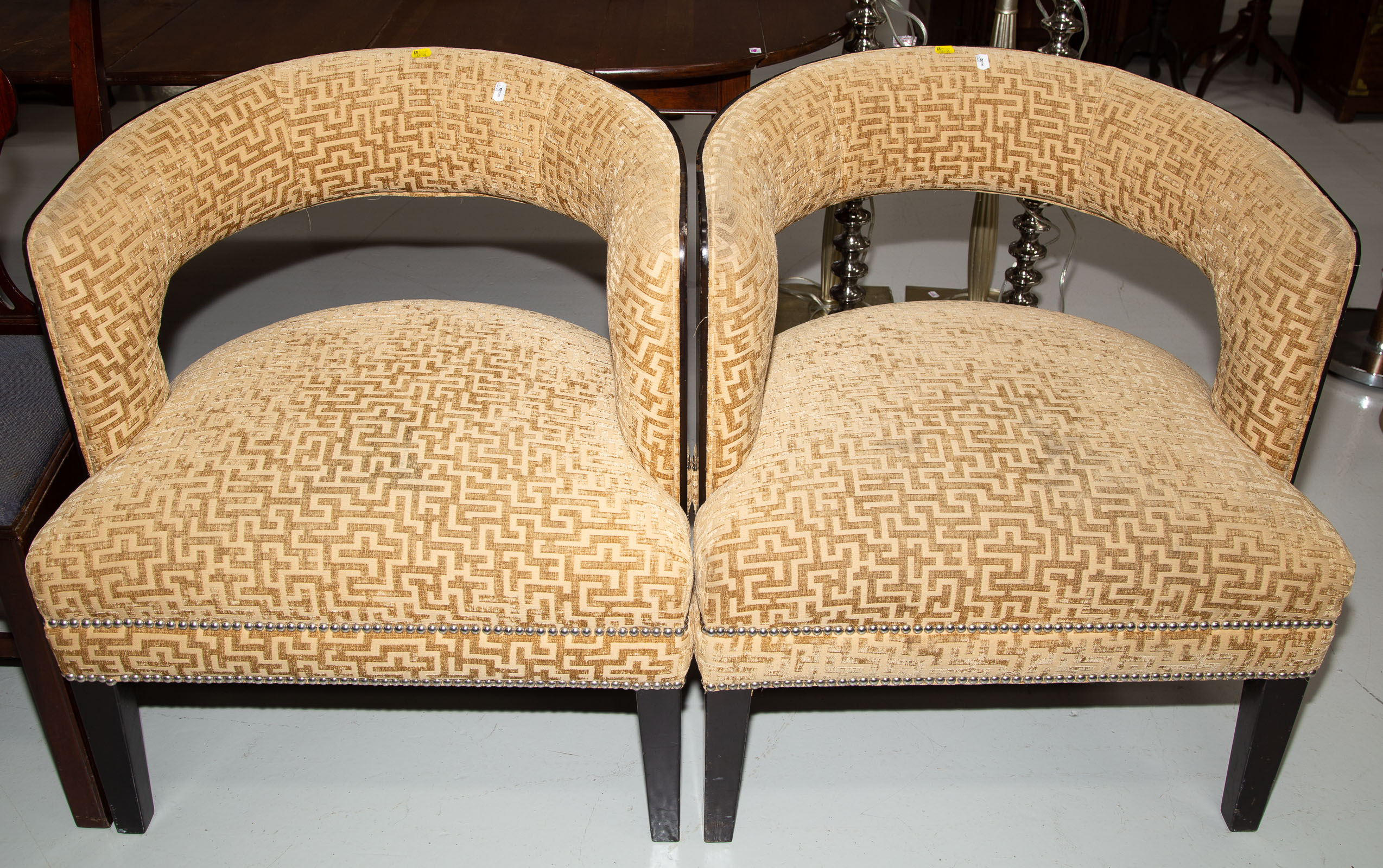 Appraisal: A PAIR OF ART DECO STYLE BARREL BACK CHAIRS Late