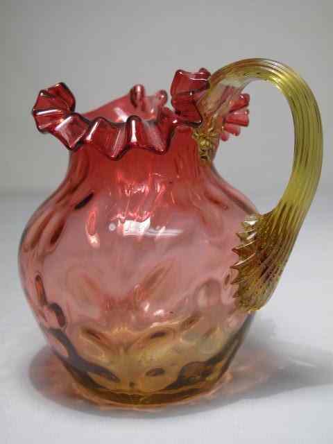 Appraisal: An Amberina glass pitcher with ruffled rim Measures '' tall