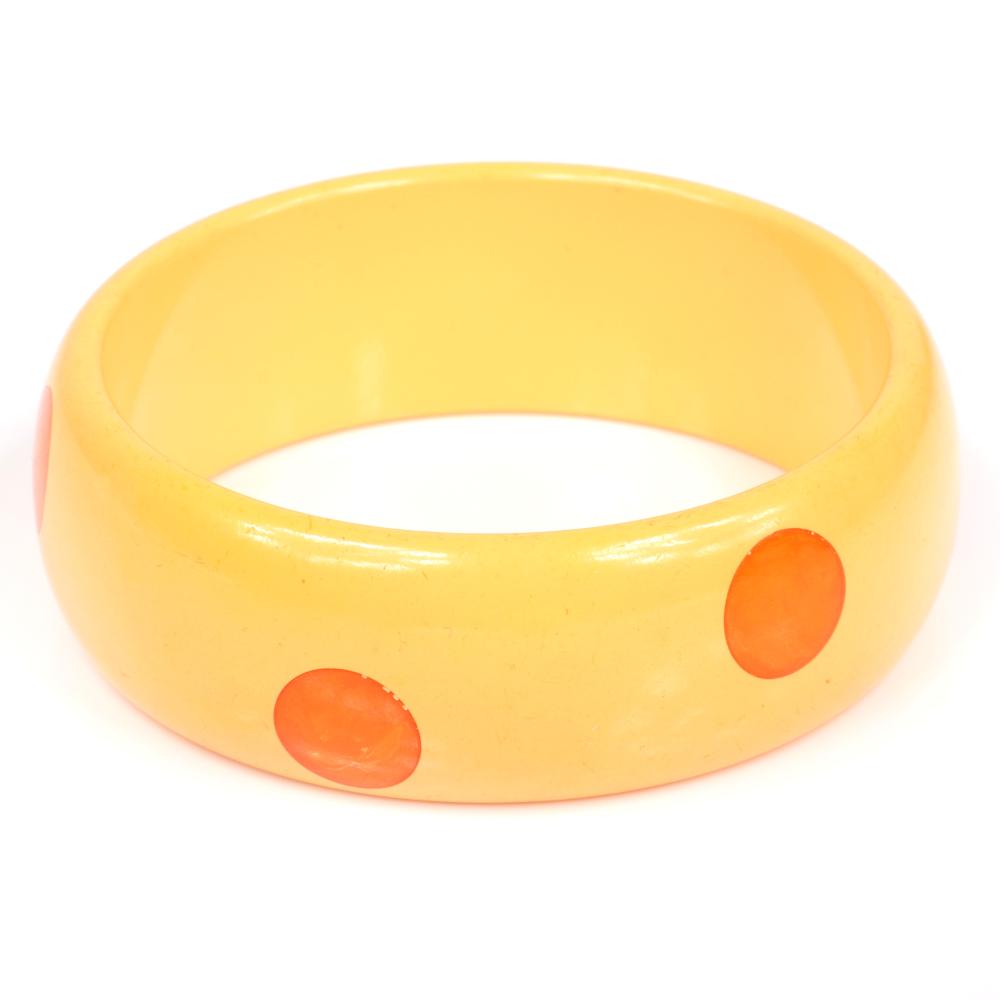 Appraisal: VINTAGE BAKELITE BANGLE WITH INLAID HI LOW POLKA DOTS IN