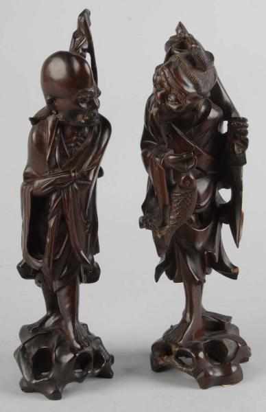 Appraisal: Pair of th Century Carved Teak Wood Statues Description Chinese