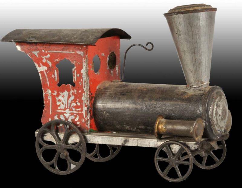 Appraisal: Early American Tin Toy Train Engine Description Circa th century