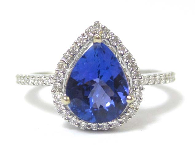 Appraisal: TANZANITE DIAMOND AND EIGHTEEN KARAT GOLD RING with appraisal The