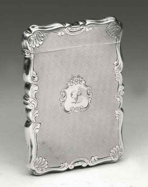 Appraisal: A VICTORIAN SILVER CARD CASE with shaped sides engine turned