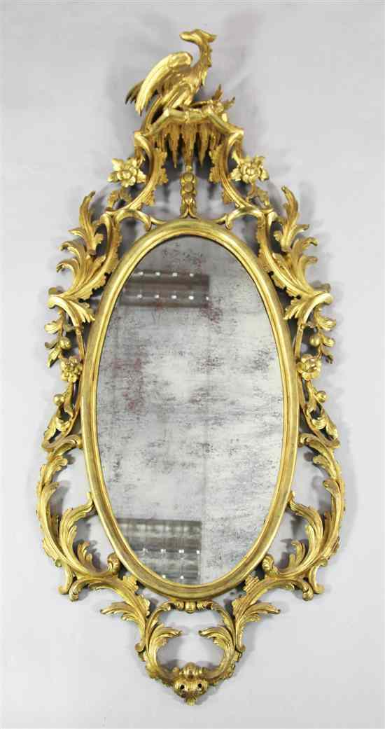 Appraisal: A George II style oval giltwood mirror ft in x