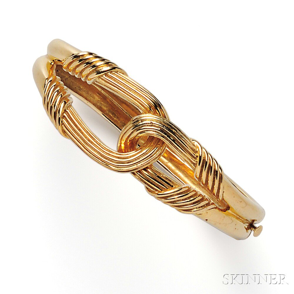 Appraisal: kt Gold Bracelet the hinged bangle with knot motif dwt