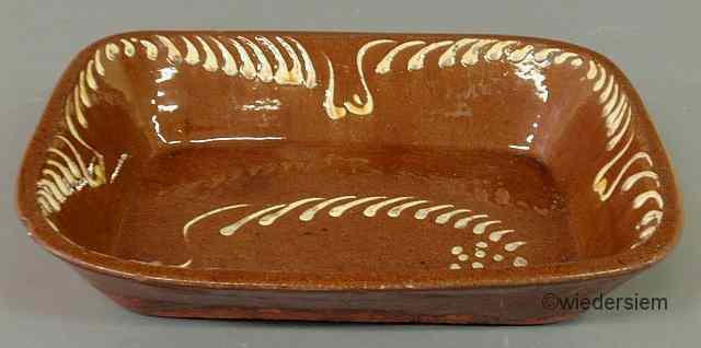 Appraisal: Redware loaf dish th c with slip decoration ''h x