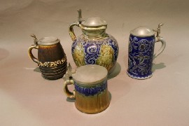 Appraisal: Three earthenware mugs and an earthenware jug with pewter lids