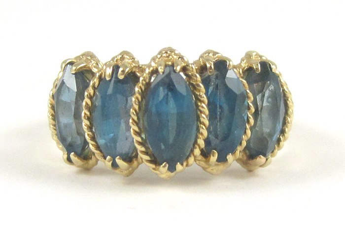 Appraisal: BLUE TOPAZ AND FOURTEEN KARAT GOLD RING set with five