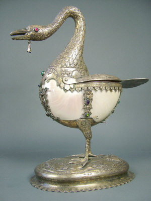 Appraisal: A Continental renaissance style white metal mounted nautilus shell swan