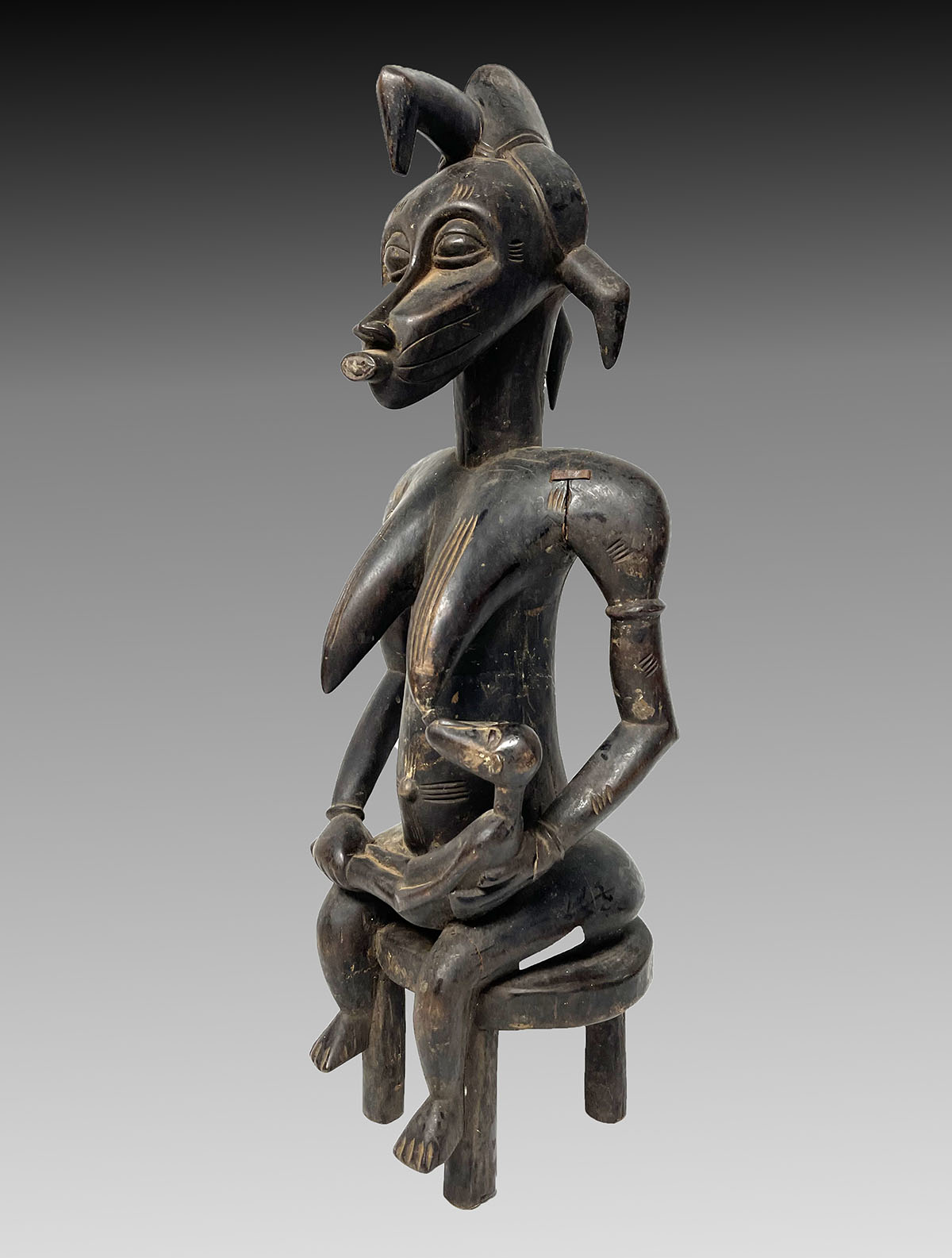 Appraisal: SENUFO AFRICAN WOOD CARVING Mother nursing her child '' in