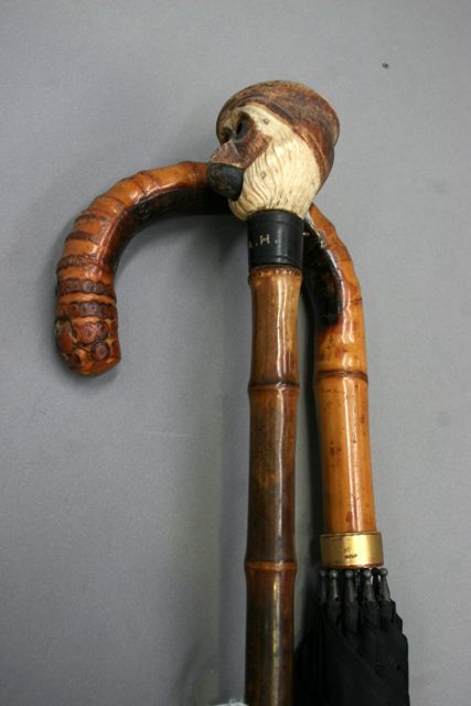 Appraisal: Two umbrellas one with an articulated bone monkey handle the