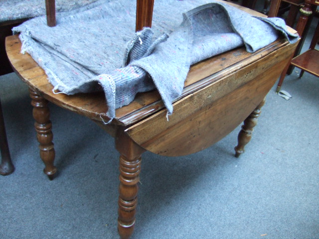 Appraisal: A French th century chestnut gate leg table on turned