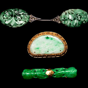 Appraisal: Three Chinese Silver Mounted Jadeite Brooches the first a bean-shaped