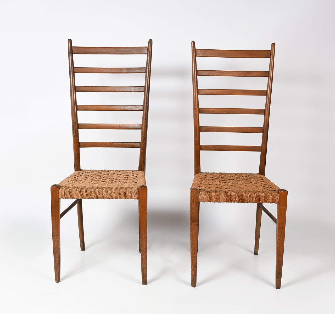 Appraisal: ITALIAN GIO PONTE LADDER BACK CHAIRS Pair of Rush seat