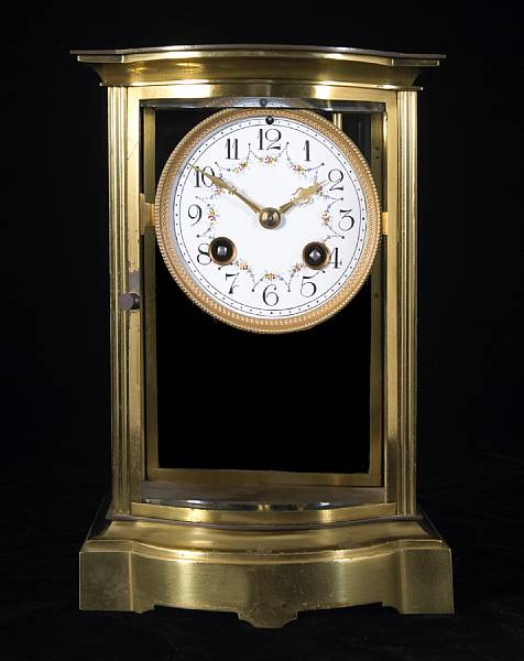 Appraisal: A French gilt brass and four glass mantel clock numbered