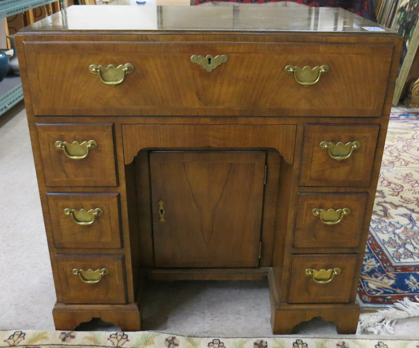 Appraisal: GEORGIAN STYLE WALNUT KNEEHOLE DESK Baker Furniture Co Stately Homes