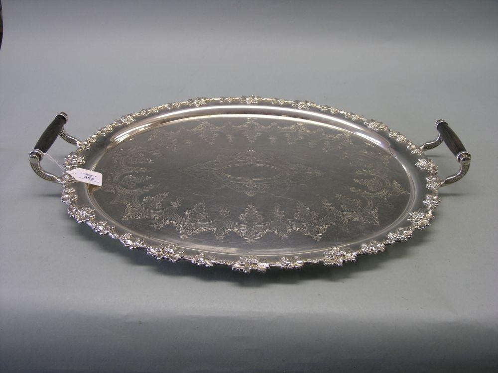 Appraisal: A large Victorian oval plated tray with lignum vitae handles